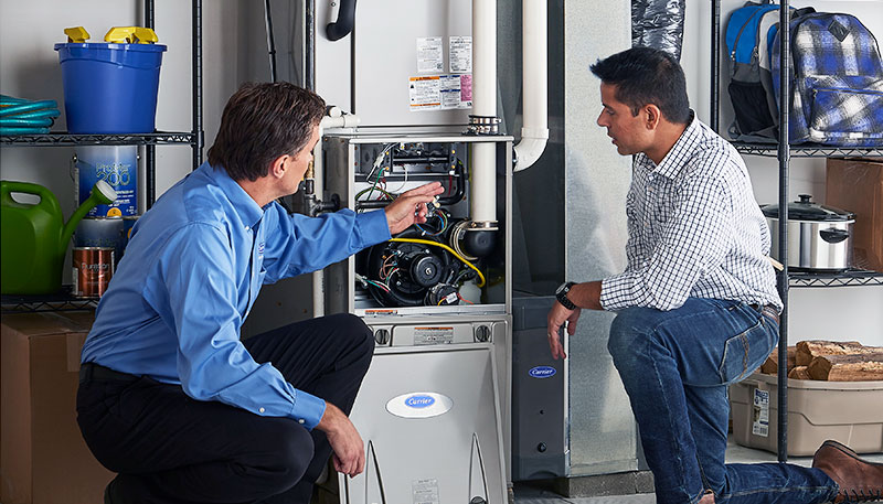 Technician evaluating a furnace for repair or replacement in Thousand Oaks