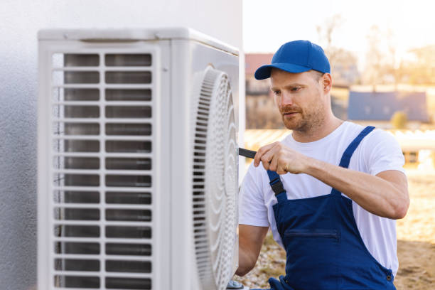 HVAC technician servicing an outdoor air conditioner in Thousand Oaks