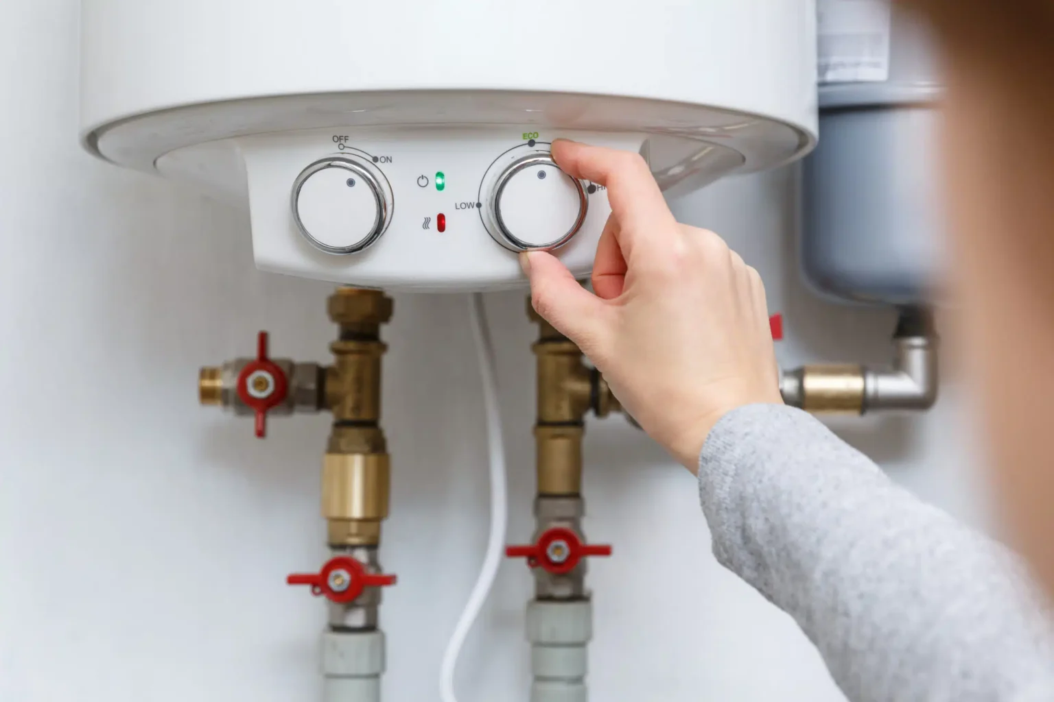 Technician adjusting a water heater in Thousand Oaks