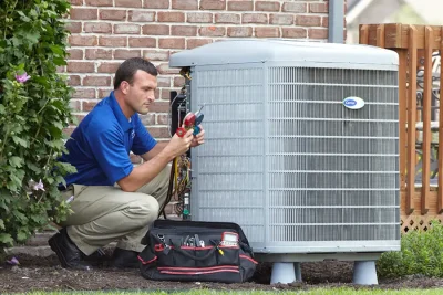 Outdoor AC Unit Inspection Thousand Oaks HVAC technician inspecting an outdoor AC unit in Thousand Oaks